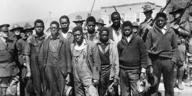 The "Scottsboro Boys," surrounded by militia.
